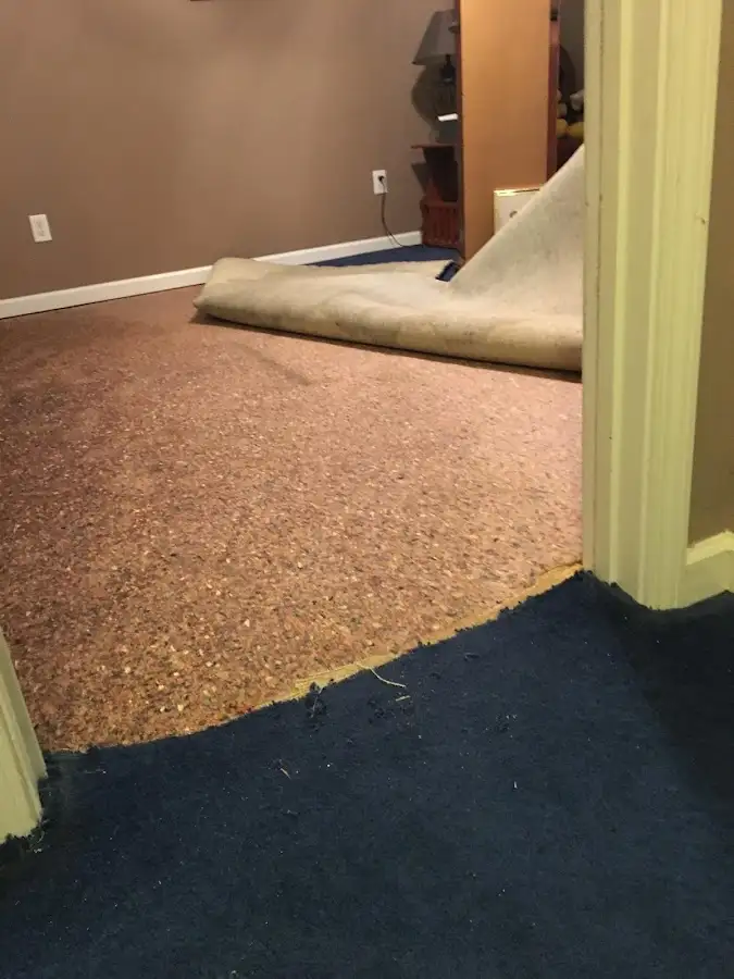 Carpet pad removal revealing water damage during Drying & Dehumidification in West Hempfield
